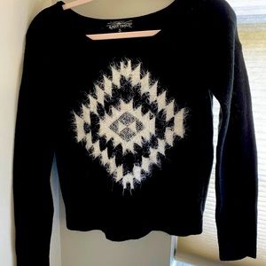 Black sweater with fuzzy white design